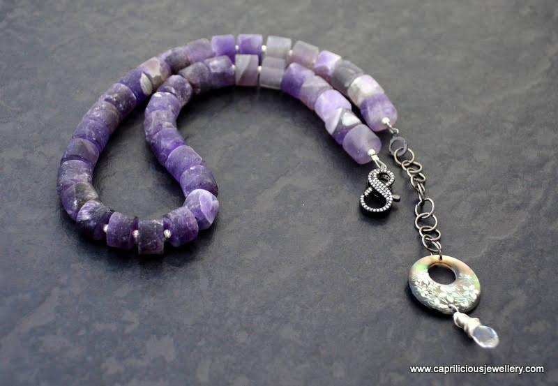 Matte amethyst cylinders in a necklace with a diamante clasp by Caprilicious Jewellery