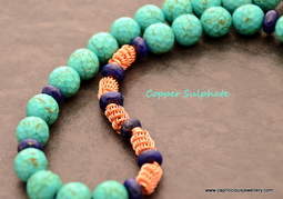 Turquoise, lapis and copper coiled wire beads with a handmade clasp by Caprilicious Jewellery