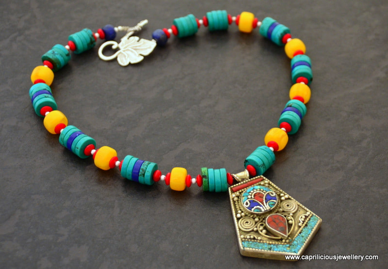 Nepalese pendant on a necklace of turquoise, coral, lapis and faux amber by Caprilicious Jewellery