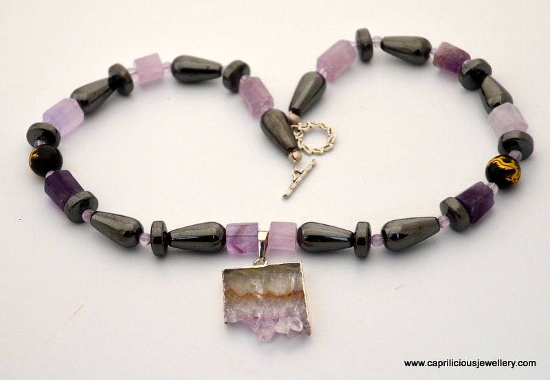 Amethyst druzy pendant on a haematite and amethyst necklace, purple and black, by Caprilicious Jewellery