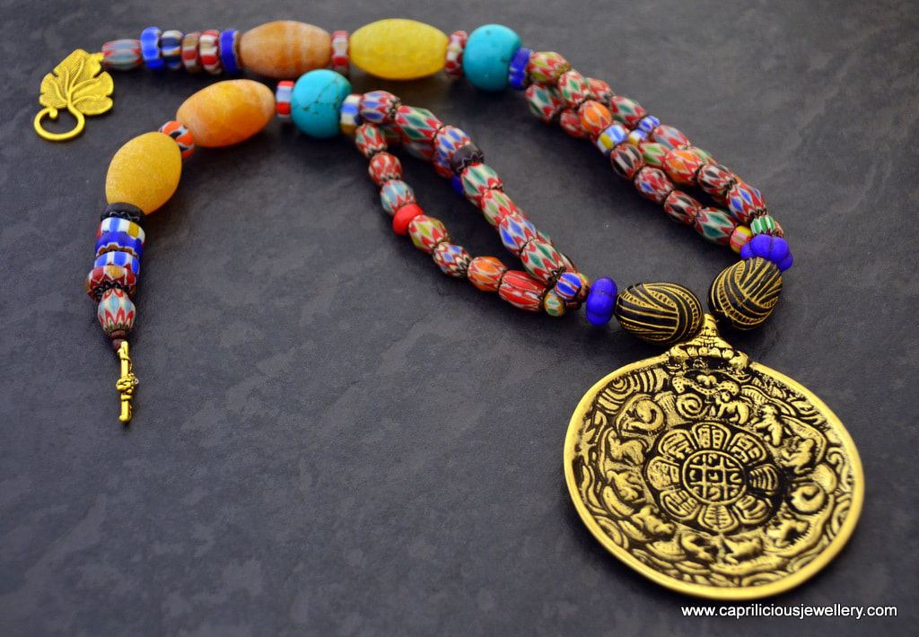 Feng Shui necklace, with a Bagua talisman on a necklace of chevron beads by Caprilicious Jewellery
