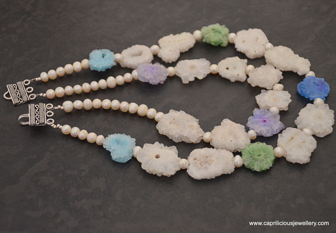 Cara - a two strand necklace of solar quartz slices of stalactites with freshwater pearls by Caprilicious Jewellery