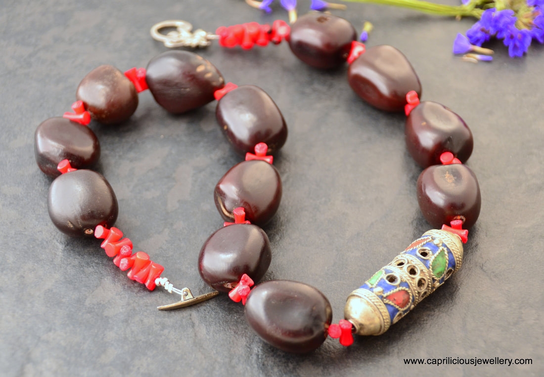 Bodhi seed and coral necklace with a Moroccan amulet by Caprilicious Jewellery