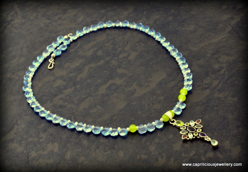 Colourful semi precious and sterling silver pendant on a blue quartz teardrop necklace by Caprilicious Jewellery