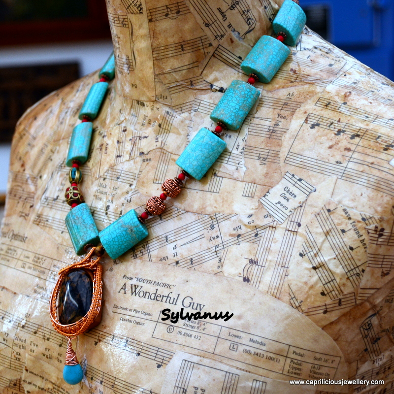 Wood fossil wirework pendant on a blue howlite necklace by Caprilicious Jewellery