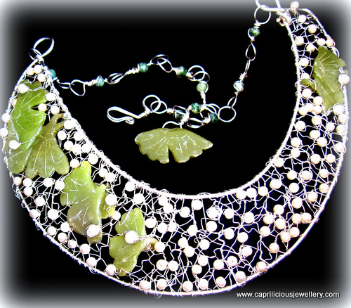 Polymer clay faux jade leaves in a bib necklace by Caprilicious Jewellery