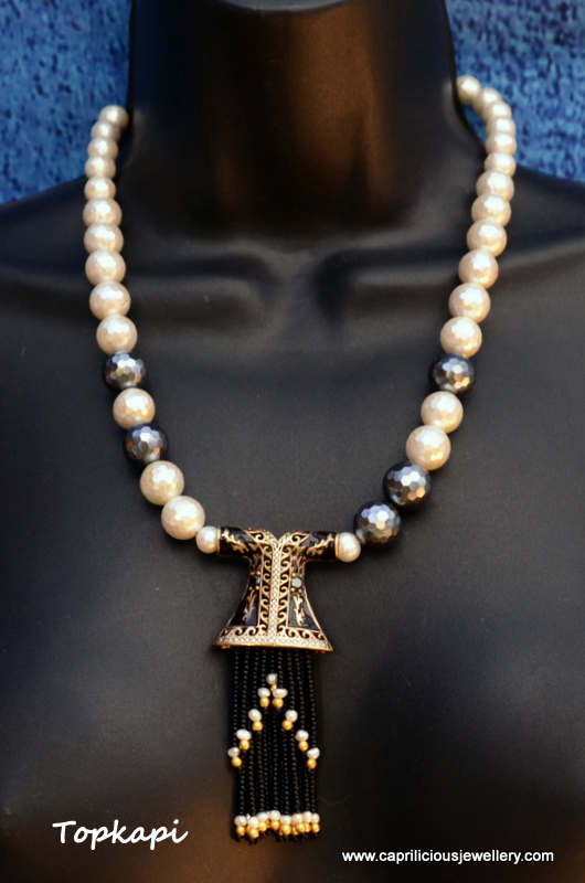 Topkapi - Turkish Kaftan tassel pendant on a faceted shell pearl necklace
