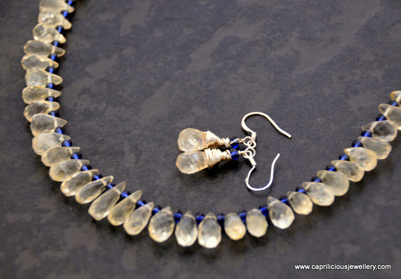 Citrine teardrops and iolite beads with a silver box clasp by Caprilicious Jewellery