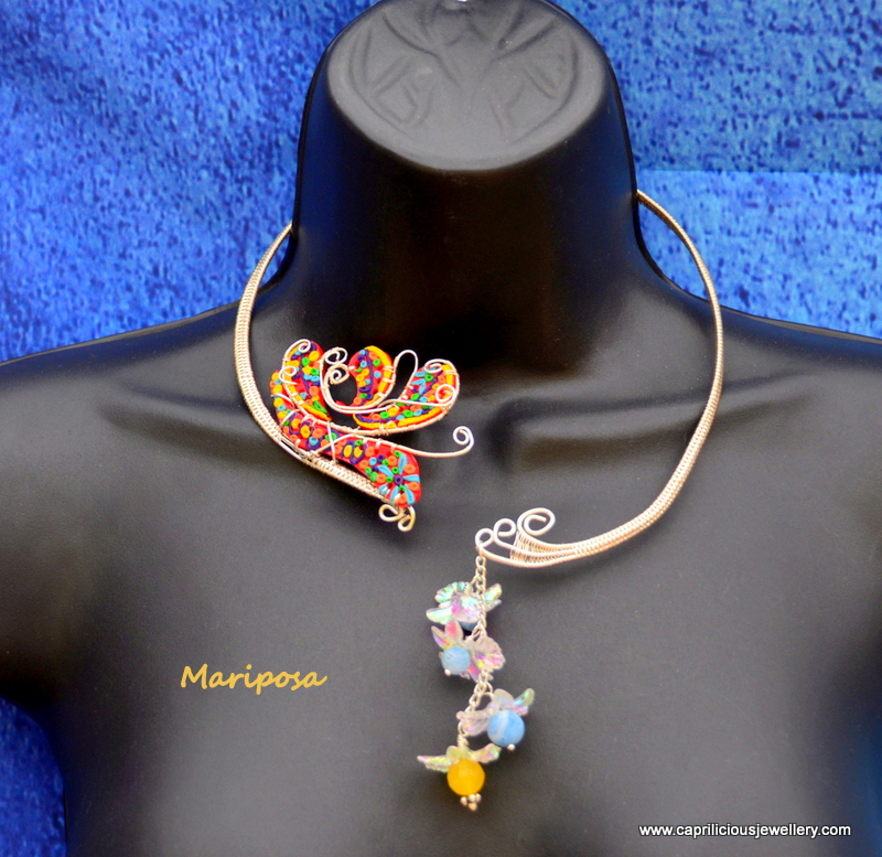 Mariposa - polymer clay and wire butterfly on a wire torque by Caprilicious Jewellery