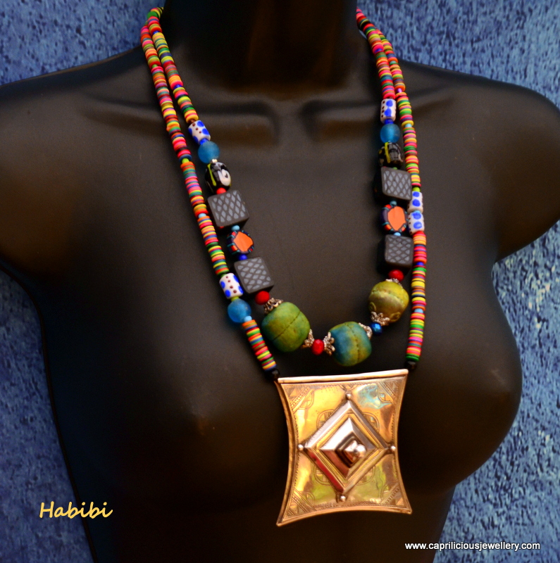 Tribal necklace with a Tcherot pendant, vinyl trade beads and polymer clay beads by Caprilicious Jewellery