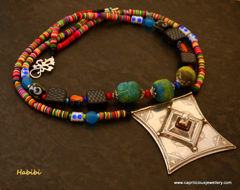 Tribal necklace with a Tcherot pendant, vinyl trade beads and polymer clay beads by Caprilicious Jewellery