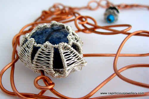 Rutilated quartz cab in an asymmetrical wire necklace by Caprilicious Jewellery