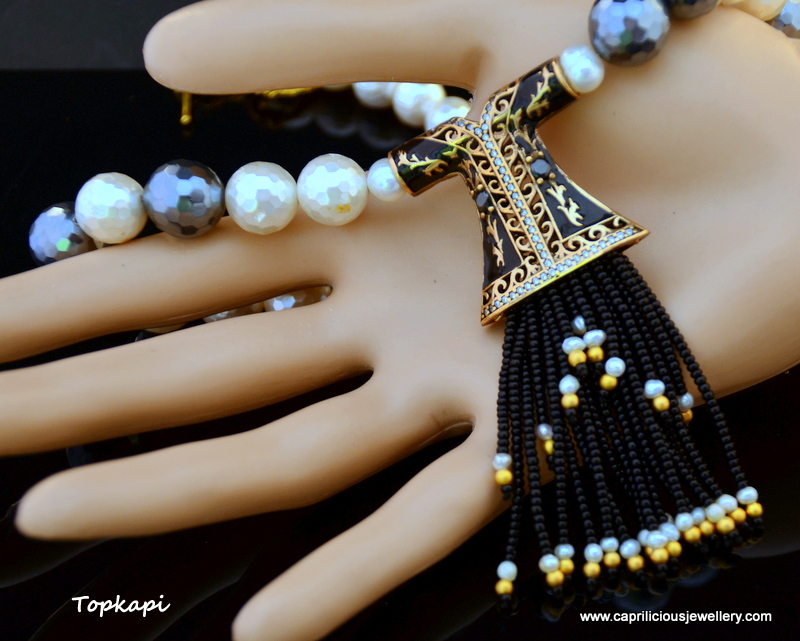 Topkapi - Turkish Kaftan tassel pendant on a faceted shell pearl necklace