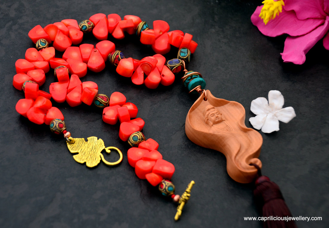 Kwan Yin pendant, bamboo coral necklace, orange coral necklace, tassel jewellery