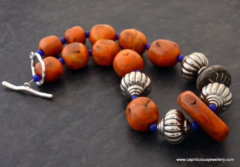 Tribal faux amber necklace with polymer clay beads  by Caprilicious Jewellery