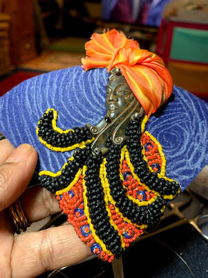 Bead Embroidery, afro caribbean art, Vintaj, dreadlocks, Shibori ribbon, face jewellery, pendant. 
